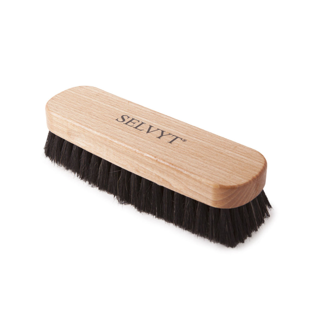 Two wooden-handled Selvyt buffing brushes with horsehair bristles, lying flat.