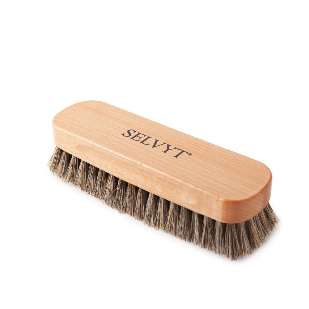 Two wooden-handled Selvyt buffing brushes with horsehair bristles, lying flat.