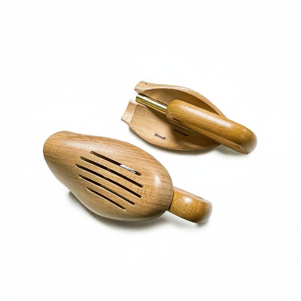Two wooden shakers on a white background