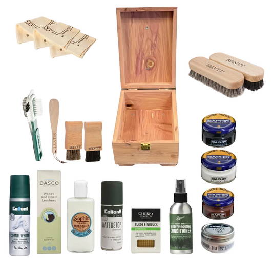 Collection of leather care products including brushes, sprays, and conditioners with a wooden box on a white background.