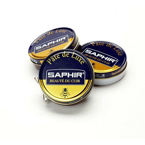 Three containers of Saphir Pate de Luxe wax shoe polish, with the brand's logo and the words 'Beauty of Leather' displayed on the lids.